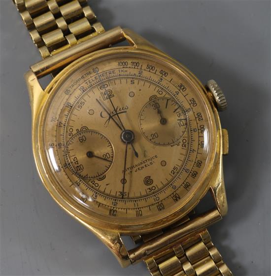 A gentlemans 18ct gold chronograph manual wind wrist watch on a 9ct gold bracelet.
